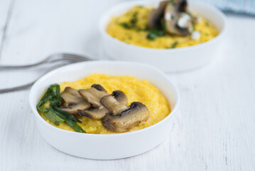 Bright polenta with frozen mushrooms-  healthy food.