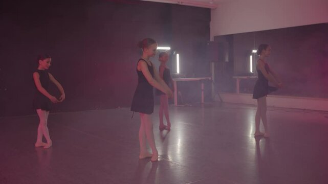 Young girls in dance class performing incredibly majestic dancing