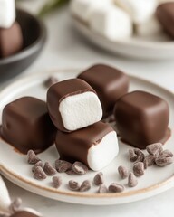 Fototapeta premium Chocolate Coated Marshmallows on Plate with Chocolate Chips