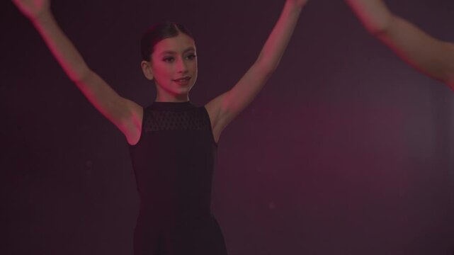 Young girls in dance class performing incredibly majestic dancing