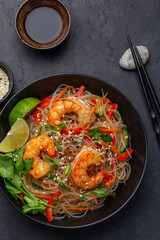 close up of rice noodles with shrimps and  vegetables