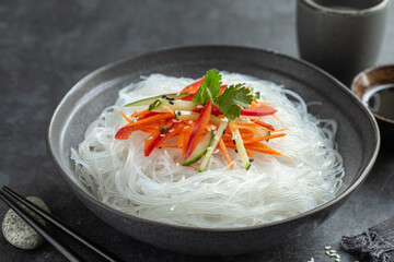 cooked funchoza rice noodles with vegetables