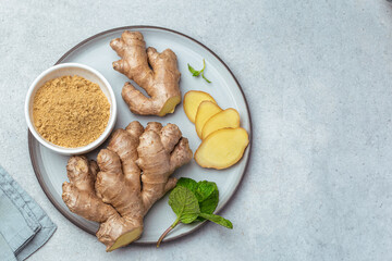 sliced fresh ginger root,  ginger powder and mint leaves