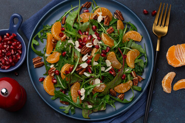 tangerine, ruccola, nuts and pomegranate salad