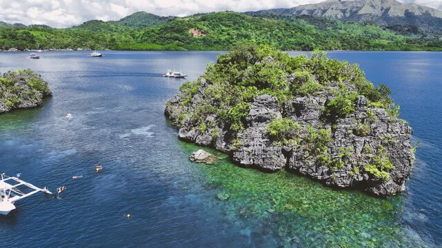 4K Drone View Of Seven Islands of Siete Pecados, Coron island, Palawan, Philippines
showcases the cluster of seven distinct islands surrounded by vibrant blue and crystal clear waters