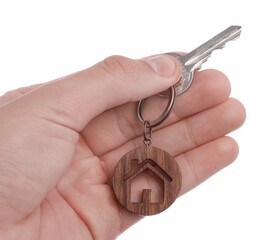 Real estate agent with house key on white background, closeup