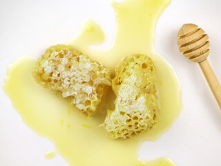 Fresh honeycombs filled with fresh honey - on white background.