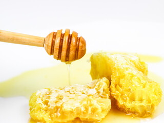 Fresh honeycombs filled with fresh honey - on white background.