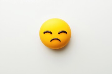 Fototapeta premium Isolated round emoticon expressing sadness.