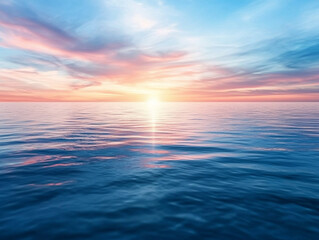 Obraz premium serene ocean view at sunset, showcasing soft pink and blue clouds reflecting on calm water surface, creating tranquil and peaceful atmosphere