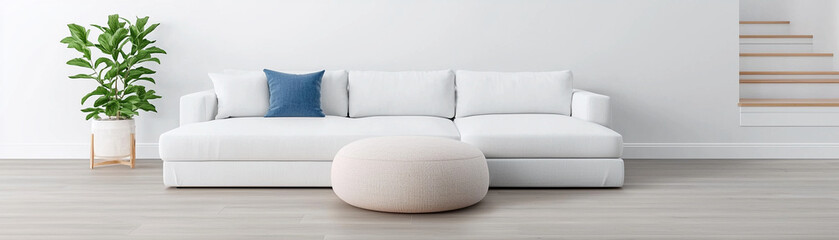 Obraz premium modern living room featuring white sectional sofa, round ottoman, and potted plant, creating serene and inviting atmosphere. minimalist design enhances space elegance