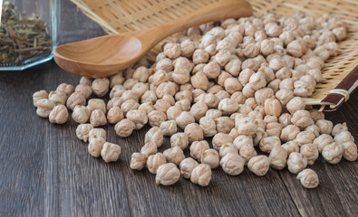 chickpeas scattered on a wooden table