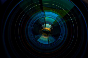Macro camera lens,Camera lens on blur night city ,Photo or video camera lens with light reflections close-up on the black background.