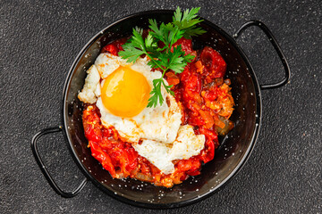 Fried egg tomatoes shakshuka vegetable dish appetizer fresh delicious gourmet food background on the table rustic food top view copy space vegetarian  food