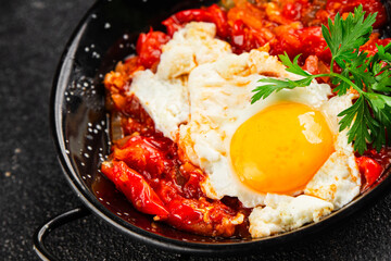 Fried egg tomatoes shakshuka vegetable dish appetizer fresh delicious gourmet food background on the table rustic food top view copy space vegetarian  food
