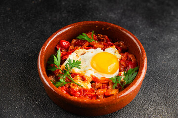 Fried egg tomatoes shakshuka vegetable dish appetizer fresh delicious gourmet food background on the table rustic food top view copy space vegetarian  food