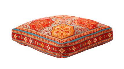 Close up of a patterned square floor cushion on black background