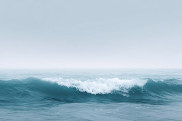 Naklejka premium Gentle ocean waves rolling on a calm sea under a soft gray sky with serene atmosphere and tranquil water surface reflecting peaceful nature concept