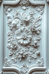 Ornate floral relief sculpture on a panel with a light blue color.