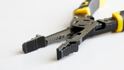 Sleek multifunctional steel pliers with yellow and black handles open on white background, perfect...