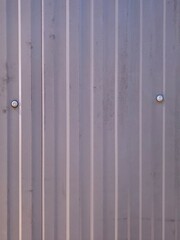 Corrugated Metal Wall with Bolts Close-Up