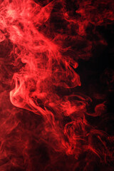 Fototapeta premium Swirling red smoke or mist with suspended particles, creating an ethereal, dynamic, and captivating visual effect against a dark atmospheric background.