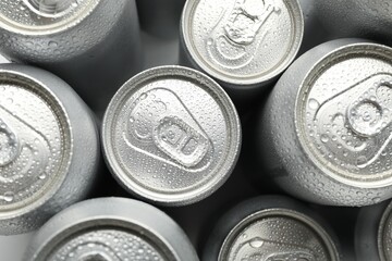 Many different tin cans on table, top view