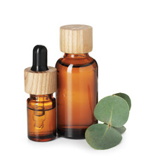 Bottles of essential oil and eucalyptus leaves isolated on white