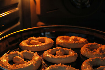 Baking dish with pretzels in oven, closeup