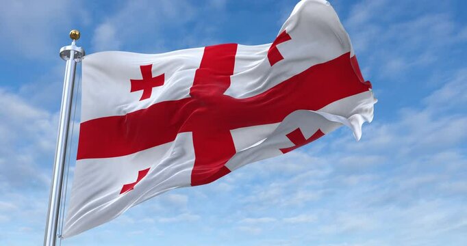 Georgia flag with flagpole waving in wind, rolling clouds background looping, 4K video (Perfect Loop)