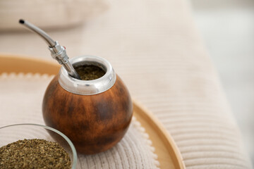 Traditional yerba mate tea on table, closeup