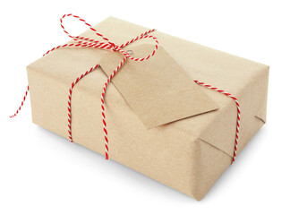 Gift wrapped in kraft paper with bow and card isolated on white