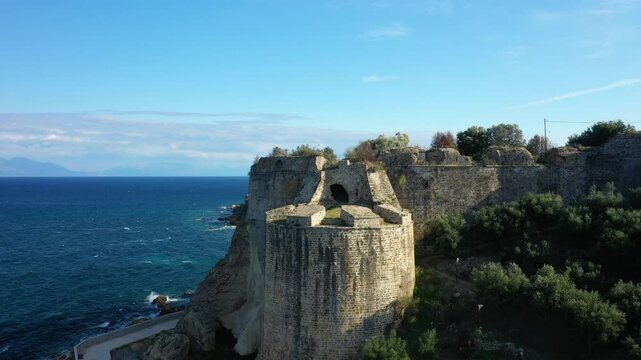 The tower of Koroni Castle in the middle of greenery in Europe, Greece, Peloponnese, Mani, in summer, on a sunny day.&nbsp;