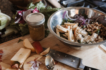 chopping apples to add to an autumn salad