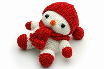Cute knitted snowman with red scarf and hat, perfect for winter decor.