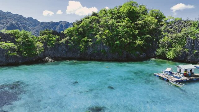 4K Drone View Of Seven Islands of Siete Pecados, Coron island, Palawan, Philippines
showcases the cluster of seven distinct islands surrounded by vibrant blue and crystal clear waters