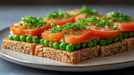 Gourmet open-faced sandwiches with smoked salmon, tomatoes, and peas