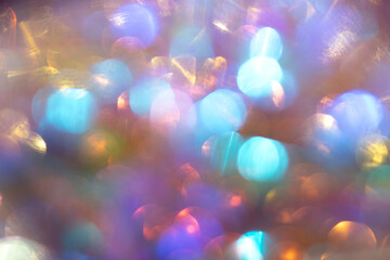 Abstract colorful bokeh lights in vibrant blue, amber, and purple tones