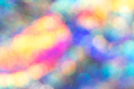 Abstract colorful bokeh background with vibrant light patterns and glowing highlights