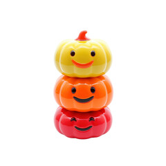 Fototapeta premium Stack of Three Smiling Pumpkins in Yellow, Orange, and Red