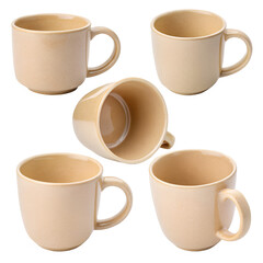 Five beige ceramic mugs with handles, arranged in a circular pattern, some upright and one on its side, against a transparent background