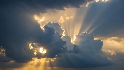 Sunlight streaming through dramatic clouds creating a beautiful and ethereal sky landscape view