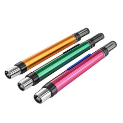 Three colorful cylindrical objects, gleaming against a stark dark backdrop