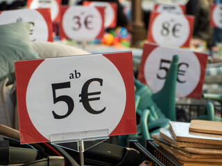 Flea Market Signs Displaying Pricing for Bargain Finds