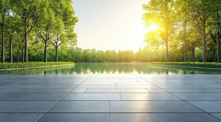 A paved walkway leading to a calm pond in a lush green park, illuminated by the golden rays of the setting sun