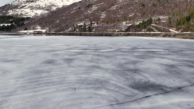 Aerial view of Lake Vasslivatnet nestled in the mountains between Orkanger and Vinjeora, Norway