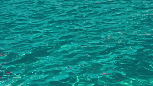 Serene Turquoise Ocean Waves - Calm Rippling Water with Emerald & Pink Reflections - 4K for Relaxation & Travel Videos  