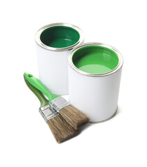 Cans of green paints and brushes isolated on white