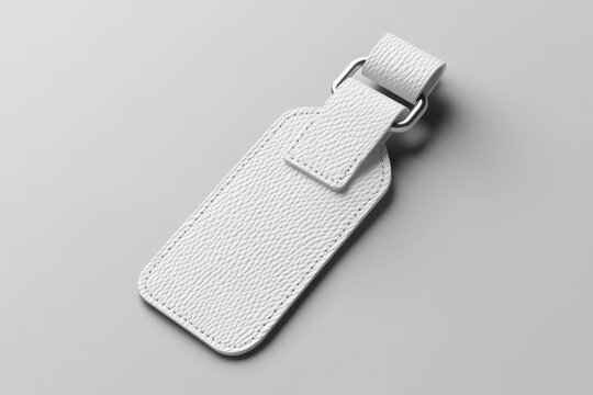 Stylish, blank, white leather luggage tag, ready for personalization.