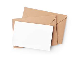 Blank greeting card and paper envelopes on white background, top view